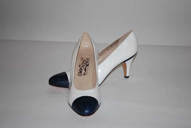 Appraisal: Salvatore Ferragamo White pumps with navy trim Size B Price