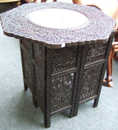 Appraisal: An Eastern carved hardwood and bone inlaid occasional table with