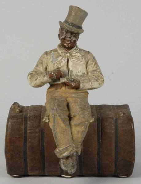 Appraisal: Cast Iron Man on Bale of Cotton Doorstop Description Manufactured