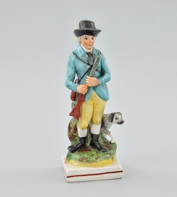 Appraisal: A Staffordshire Figurine of a Hunter and His Dog Standing