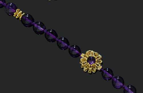 Appraisal: AMETHYST AND GOLD SAUTOIR Yellow gold Casual-elegant necklace of amethyst