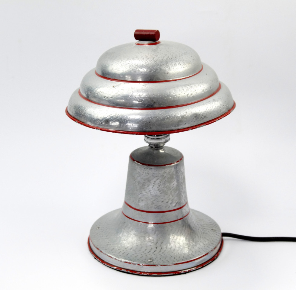 Appraisal: An Art Deco metal lamp base and shade with modern