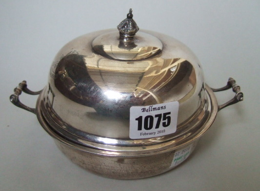 Appraisal: A silver circular twin handled lidded muffin dish the lid