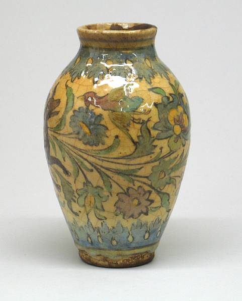 Appraisal: A Persian pottery polychrome decorated vase The ovoid vessel painted