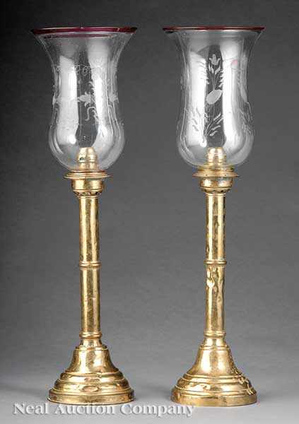 Appraisal: A Pair of Continental Brass Push-Up Candlesticks th c labeled