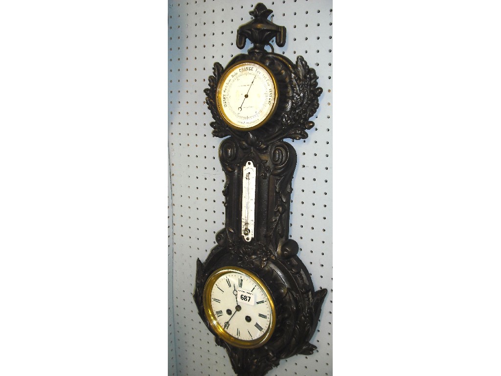 Appraisal: Cast-iron clock aneroid barometer the barometer dial signed J J