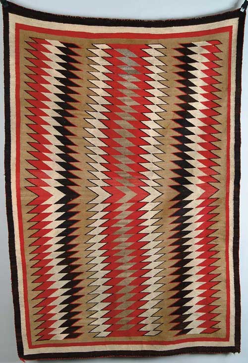 Appraisal: FINE ANTIQUE NAVAJO EYE DAZZLER RUG Center brown field having