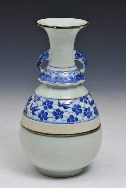 Appraisal: A CHINESE LONGQUAN CELADON TWO HANDLE VASE with bands of