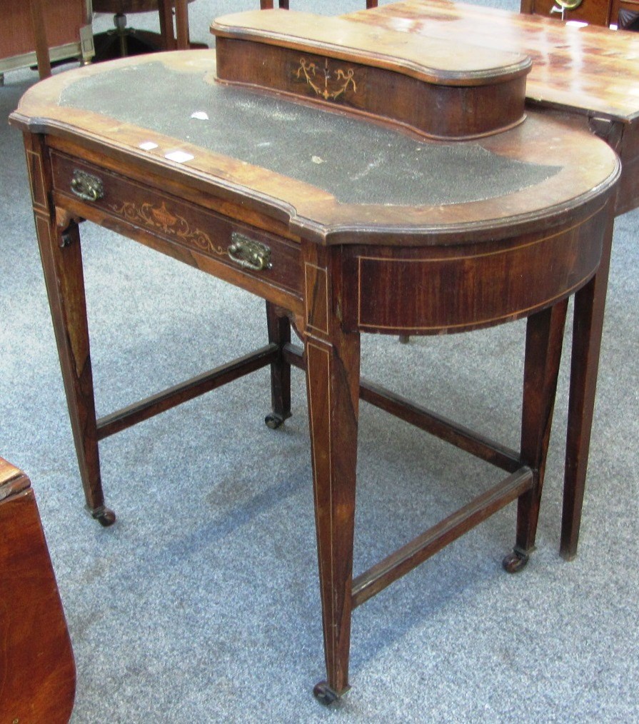 Appraisal: A late th century marquetry inlaid rosewood kidney shaped writing