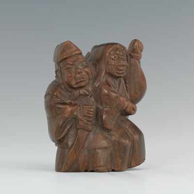 Appraisal: Carved Wooden Warrior and Prisoner Netsuke The netsuke is signed