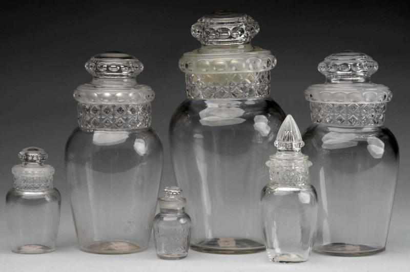 Appraisal: Lot of Glass Apothecary Candy Jars with Lids Description Four