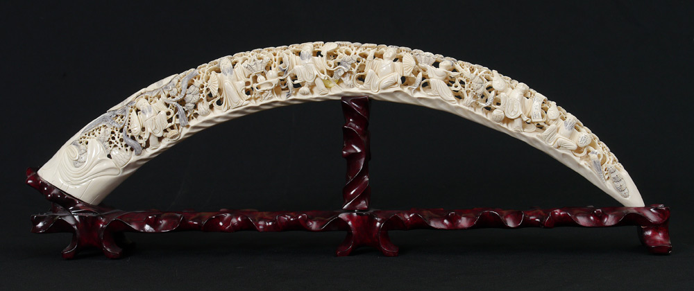 Appraisal: '' ORNATELY CARVED IVORY TUSK Pierced carved tusk with seated