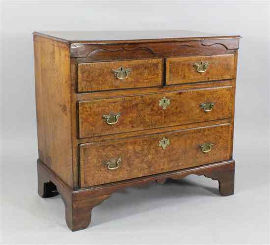 Appraisal: An early th century crossbanded burr walnut and oak chest