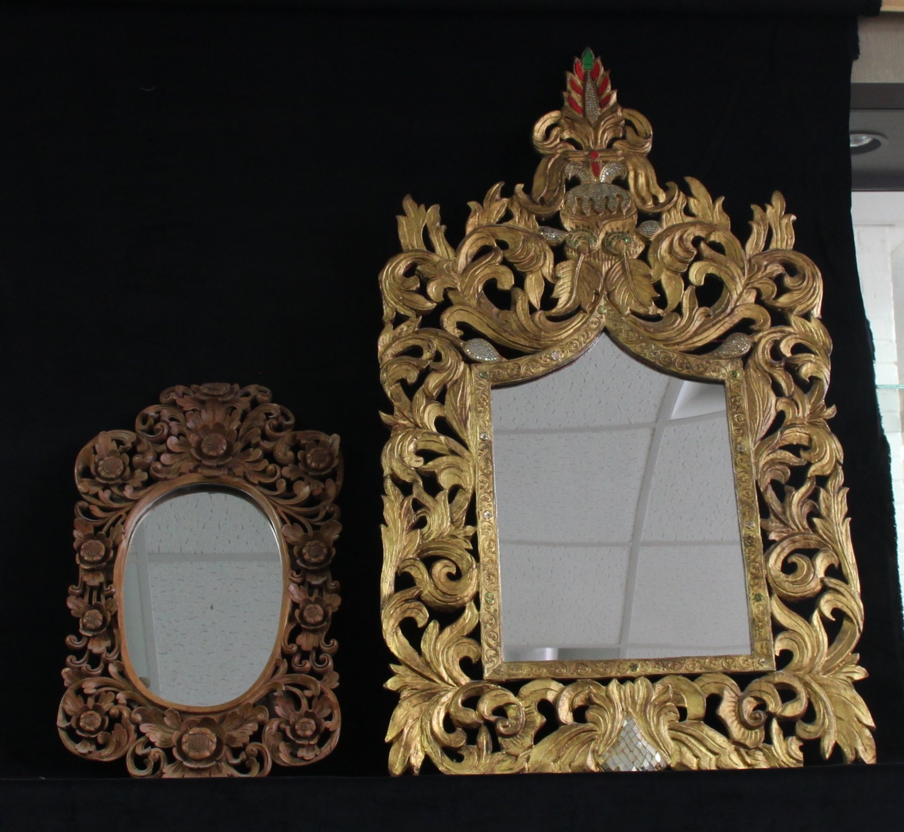 Appraisal: An Oriental style giltwood wall mirror and a carved framed