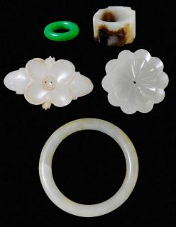 Appraisal: Five Carved Jade Objects Chinese th century circular celadon jade