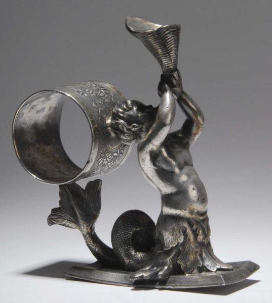 Appraisal: Triton Figural Napkin Ring Description Child of the sea Half