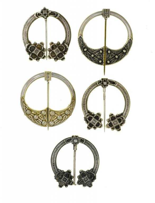 Appraisal: FIVE IRISH SILVER CELTIC REVIVAL PENANNULAR BROOCHES one parcel gilt