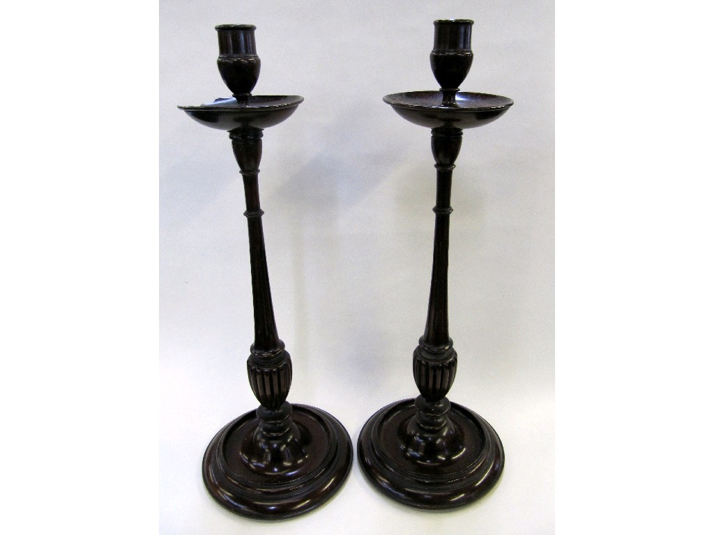 Appraisal: Pair of tall mahogany candlesticks one drip tray def