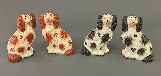 Appraisal: Two Pair Staffordshire Spaniels Red Black Two pair Staffordshire spaniels