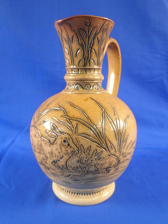 Appraisal: A Doulton Lambeth Hannah Barlow stoneware jug with incised decoration