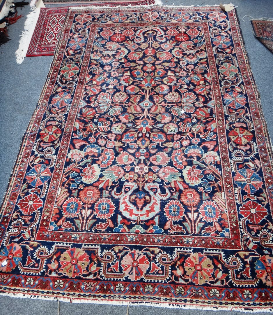 Appraisal: A Hamadan rug Persian the dark indigo field with an