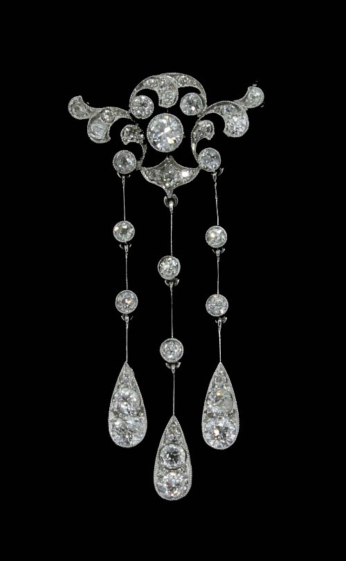 Appraisal: A diamond brooch of pierced openwork form suspending three drops