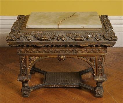 Appraisal: RENAISSANCE-STYLE CARVED GILTWOOD LOW TABLE WITH ONYX TOP The rectangular