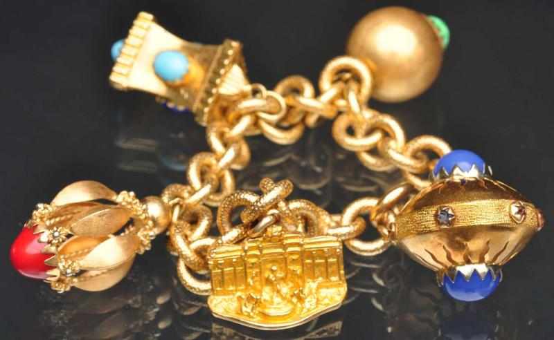 Appraisal: K Y Gold Charm Bracelet With five charms one is