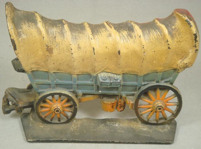 Appraisal: Cast iron doorstop large hollow back covered wagon on brown