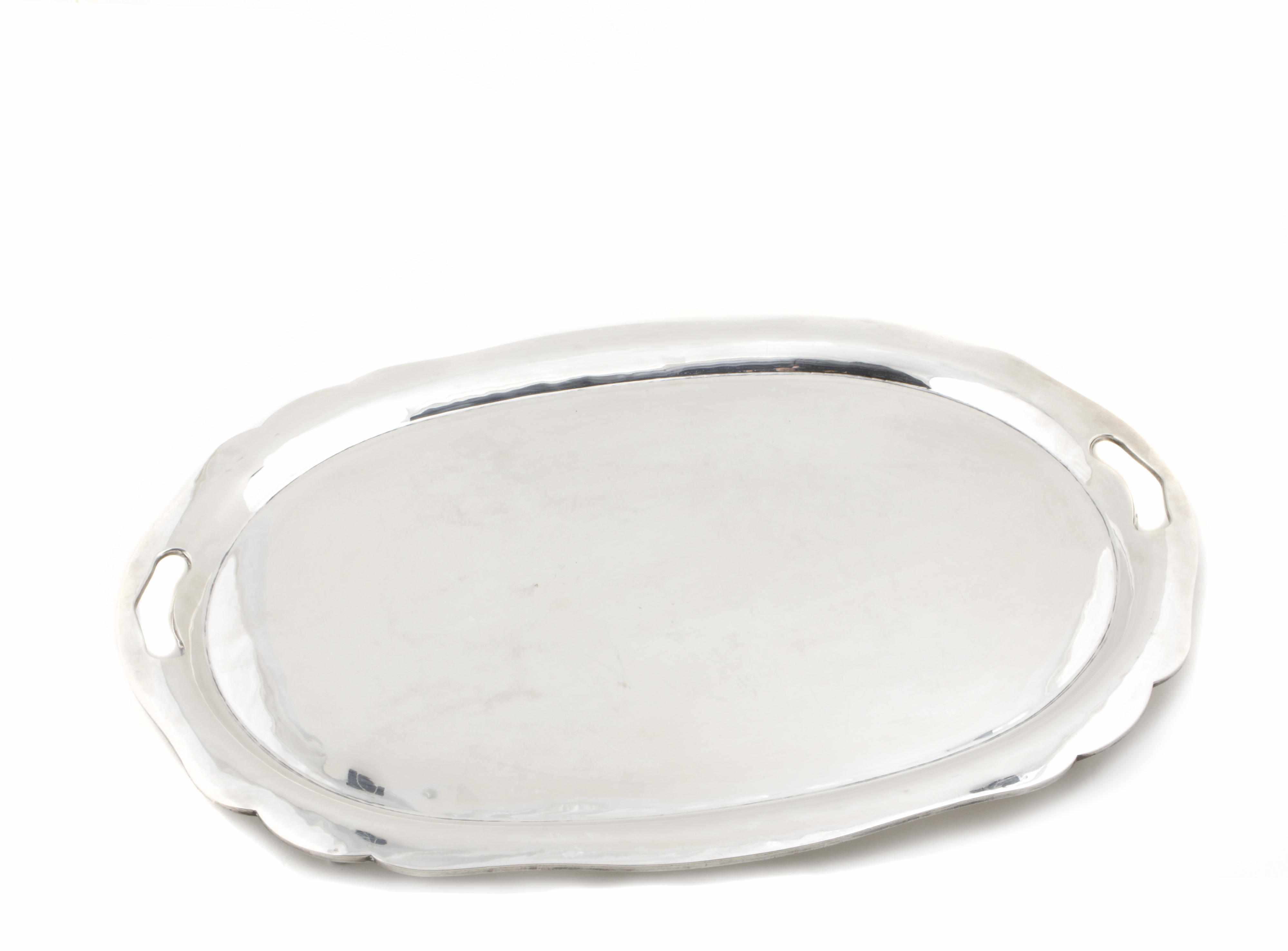 Appraisal: A Mexican sterling footed oval tea tray with pierced handles