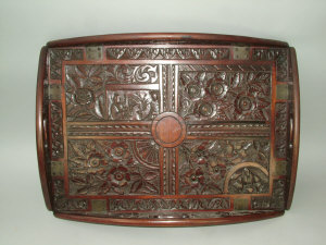 Appraisal: A carved mahogany oval butlers tray the hinged sides pierced