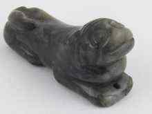 Appraisal: A Chinese black jade carving of a dog approx cm