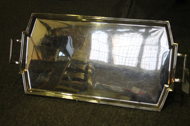 Appraisal: A SILVER TRAY of shaped rectangular form with raised border