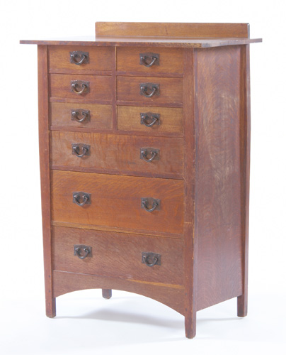 Appraisal: GUSTAV STICKLEY Nine drawer dresser with an overhanging top copper