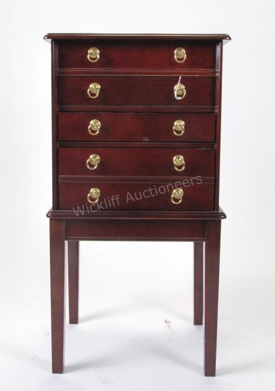 Appraisal: A mahogany -drawer Chippendale style chest lift top reveals secret