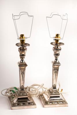 Appraisal: A pair of silver plated candlesticks Walker Hall of neoclassical