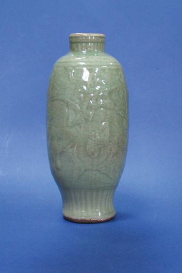 Appraisal: A CHINESE GREEN CELADON VASE the ovoid body with moulded