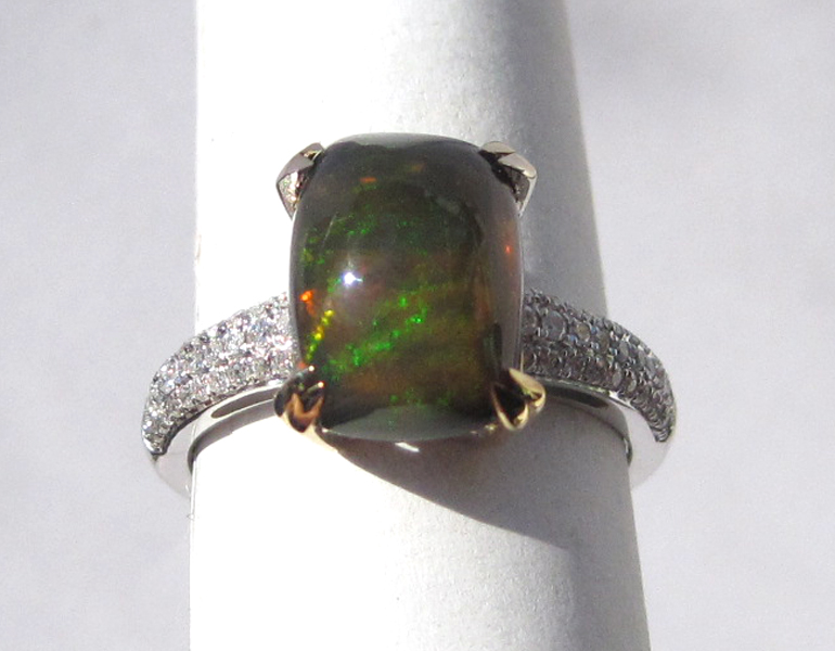 Appraisal: BLACK OPAL DIAMOND AND FOURTEEN KARAT GOLD RING The white