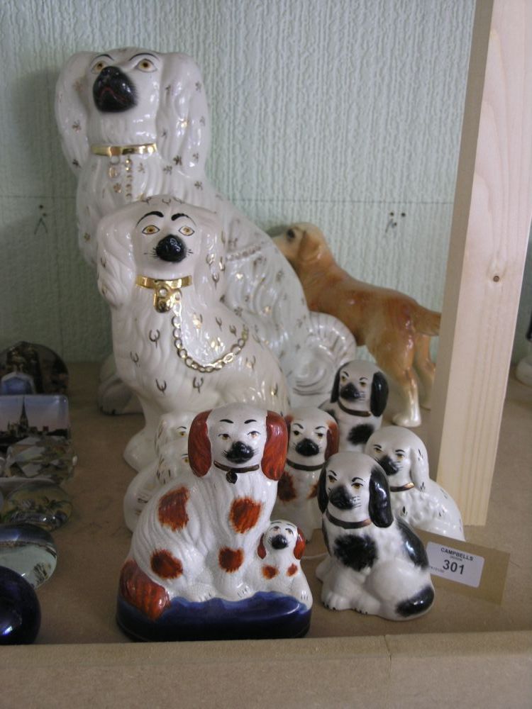 Appraisal: Nine various Victorian style Staffordshire spaniel models and an earthenware