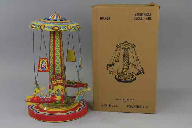 Appraisal: RIDE-A-ROCKET WITH BOX Chein tall roundabout done in lithographed tin