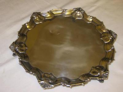 Appraisal: A VICTORIAN SALVER of shaped circular form the stylised Chippendale