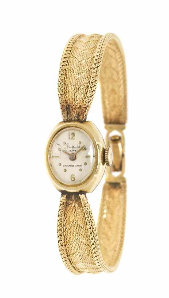 Appraisal: A Karat Yellow Gold Mechanical Wristwatch Sheffield silvered dial Arabic