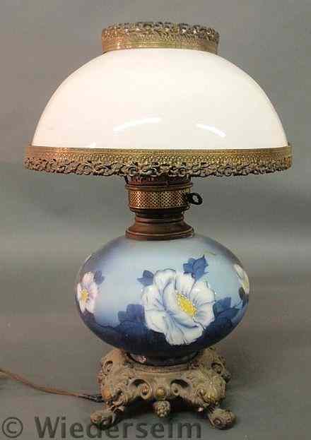 Appraisal: Gone-With-The-Wind lamp with a pot metal base and blue floral