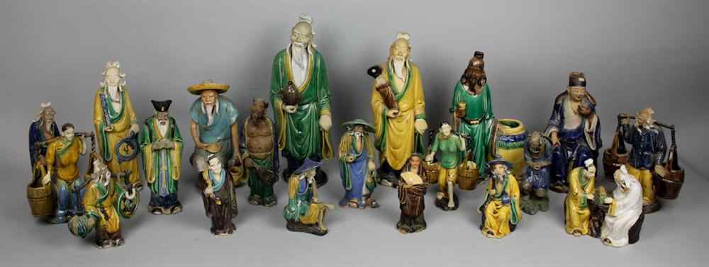 Appraisal: GROUP OF TWENTY CHINESE GLAZED POTTERY FIGURES each figure a