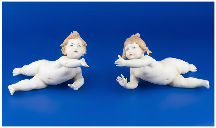 Appraisal: Pair of Bisque Piano Babies Well Modelled and Naturistically Tinted