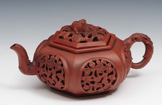 Appraisal: An Yixing hexagonal teapot th Centurywith carved blossom pierced panels