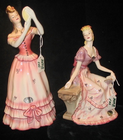 Appraisal: TWO GOLDSCHEIDER PORCELAIN FIGURES one a woman standing looking in