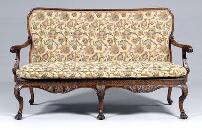 Appraisal: Irish Chippendale style settee finely carved mahogany with molded top