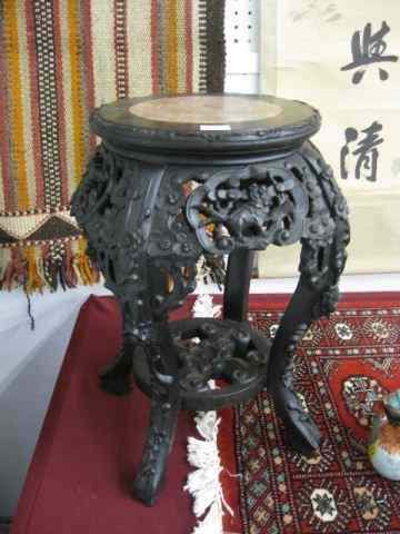 Appraisal: Chinese Carved Teak Stand red marble insert '' elaborate foo