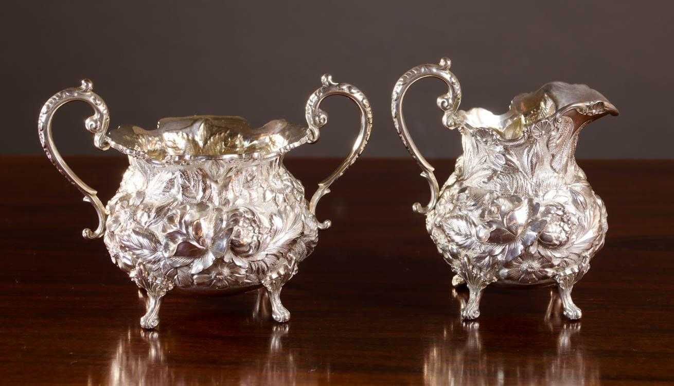 Appraisal: STIEFF REPOUSSE STERLING SILVER FOOTED CREAM PITCHER AND SUGAR BOWL